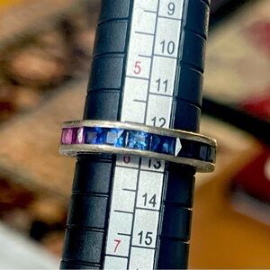 Silver eternity band with multi colored stones